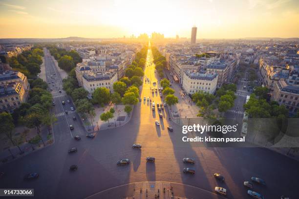 sunset with golden color over the city of paris , france - paris aerial stock pictures, royalty-free photos & images