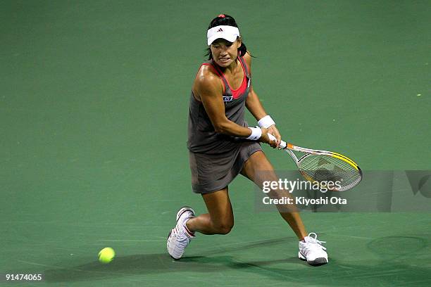 Kimiko Date Krumm of Japan returns a shot in her match against Ksenia Lykina of Russia during day two of the Rakuten Open Tennis tournament at Ariake...