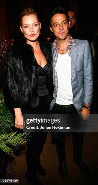 Kate Moss and Jamie Hince attend the 'Mario de Janeiro Testino' book launch at Cafe Carmen on October 5, 2009 in Paris, France.