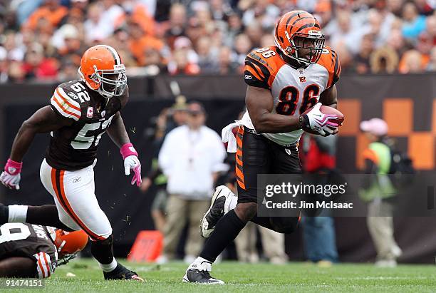 Daniel Coats of the Cincinnati Bengals runs the ball against D'Qwell Jackson of the Cleveland Browns during their game at Cleveland Browns Stadium on...