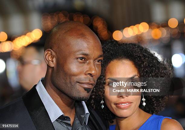 Actor Jimmy Jean-Louis and Evelyn Jean-Louis pose for photographers as they arrive on the red carpet for the premiere of the new Universal Pictures...