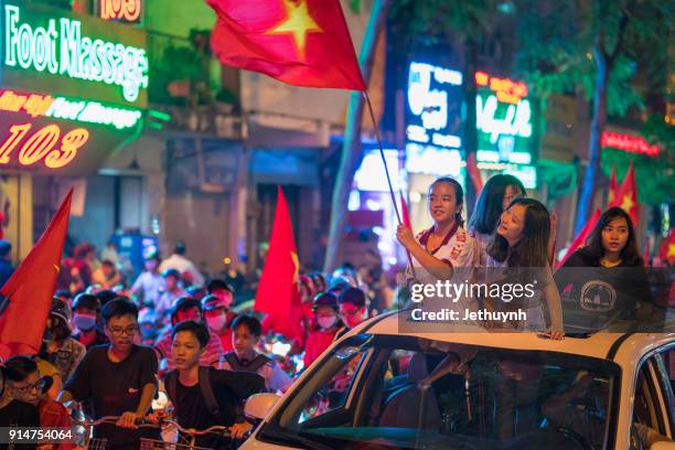 vietnamese football fans rally after historic qatar winning at ho chi minh city - vietnamese football fans rally after historic qatar win bildbanksfoton och bilder