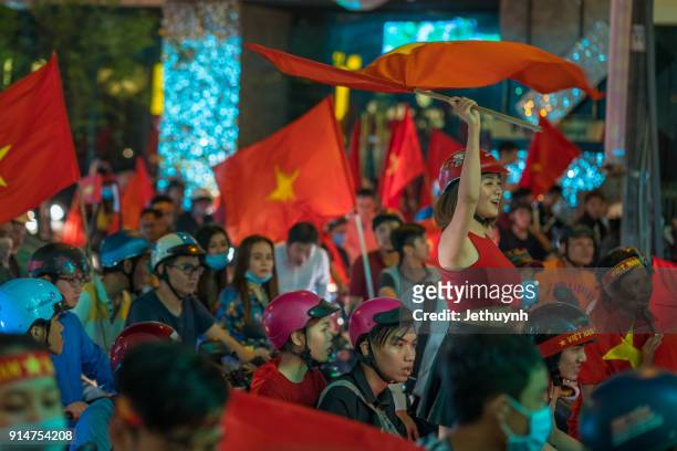 vietnamese football fans rally after historic qatar winning at ho chi minh city - vietnamese football fans rally after historic qatar win bildbanksfoton och bilder