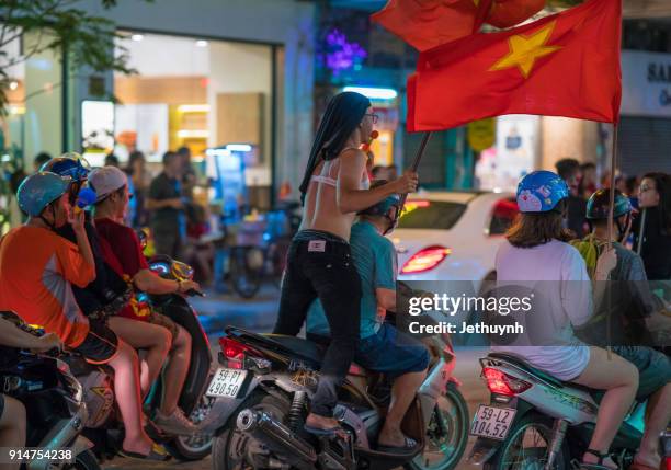 vietnamese football fans rally after historic qatar winning at ho chi minh city - vietnamese football fans rally after historic qatar win bildbanksfoton och bilder