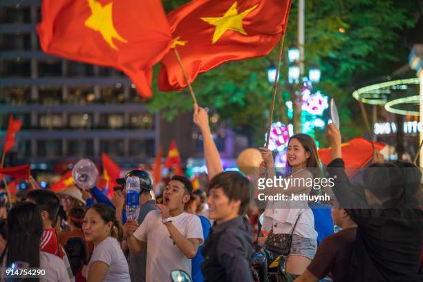 vietnamese football fans rally after historic qatar winning at ho chi minh city - vietnamese football fans rally after historic qatar win bildbanksfoton och bilder