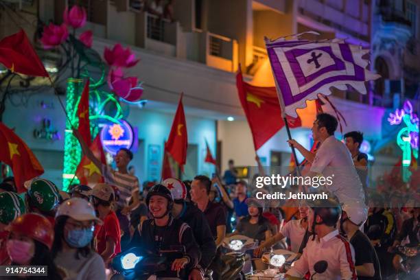 vietnamese football fans rally after historic qatar winning at ho chi minh city - vietnamese football fans rally after historic qatar win bildbanksfoton och bilder