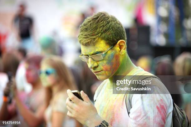 festival of paints holi in rostov-on-don - holi portraits stock pictures, royalty-free photos & images