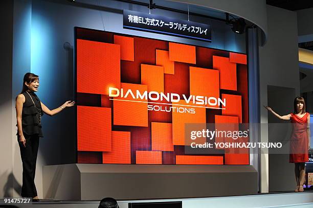 Japanese electronics giant Mitsubishi Electric displays a 155-inch sized organic light emitting diode display, which consists of small sized OLED...