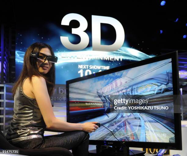 Model displays Sony's 3D television set at the Ceatec exhibition, Asia's largest electronics trade show in Chiba, suburban Tokyo on October 6, 2009....