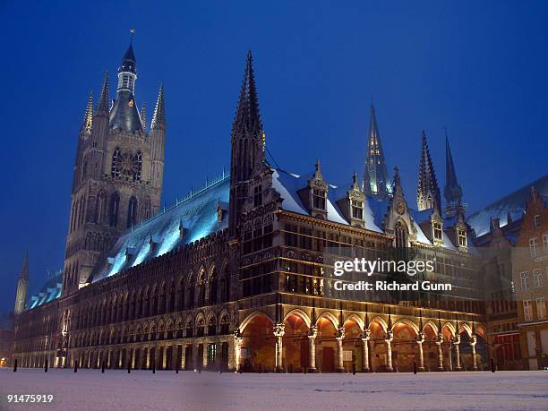 cloth house and town hall in snow, ypres - イーペル ストックフォトと画像