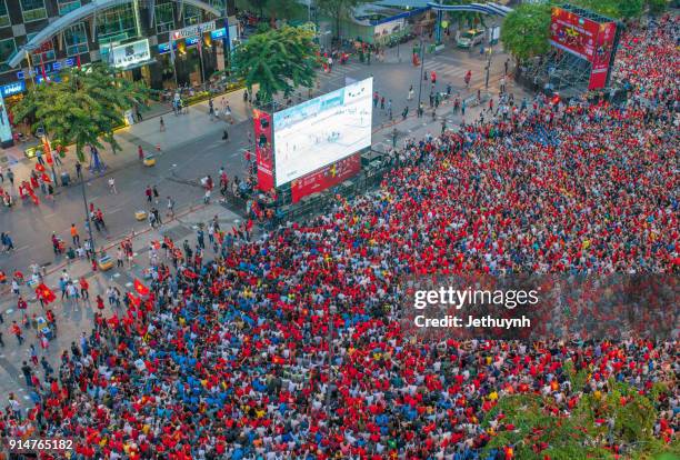 vietnamese football fans rally in nguyen hue street to watch live during historic match u-23 vietnam & u-23 uzbekistan - vietnam u23 stock pictures, royalty-free photos & images