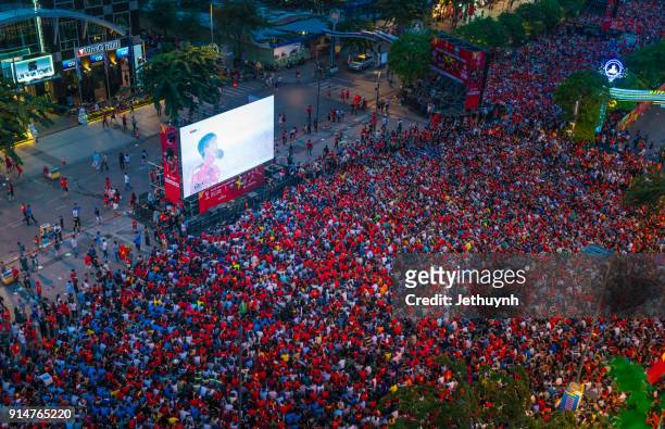vietnamese football fans rally in nguyen hue street to watch live during historic match u-23 vietnam & u-23 uzbekistan - vietnam u23 stock pictures, royalty-free photos & images