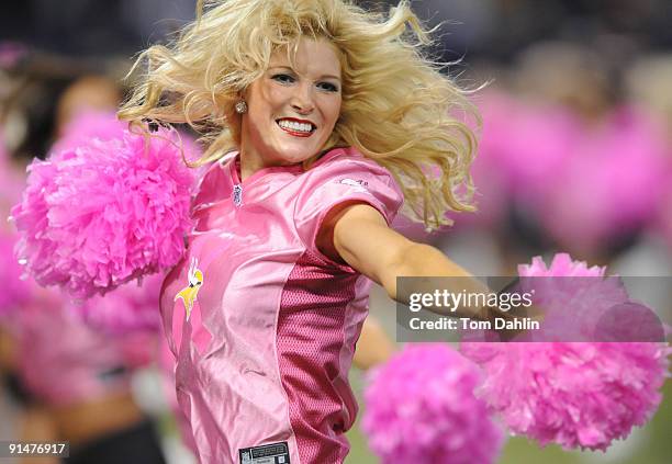 Minnesota Viking cheerleader performs during an NFL game against the Green Bay Packers at the Hubert H. Humphrey Metrodome, on October 5, 2009 in...