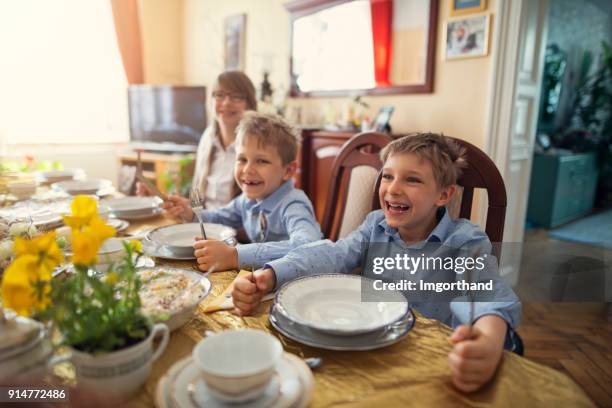 kids waiting for traditional easter breakfast - easter breakfast stock pictures, royalty-free photos & images