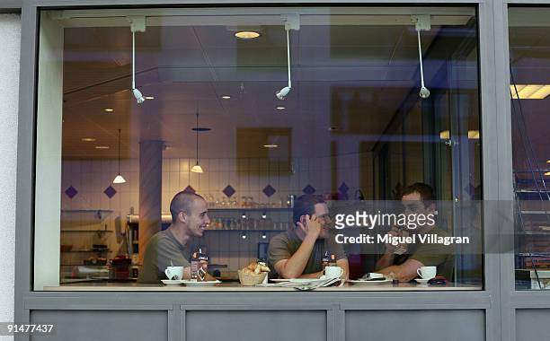 Three Swiss soldiers eat breakfast in a backery on October 6, 2009 in Pfaeffikon, Switzerland. Due to lower taxes and less regulation the small Swiss...