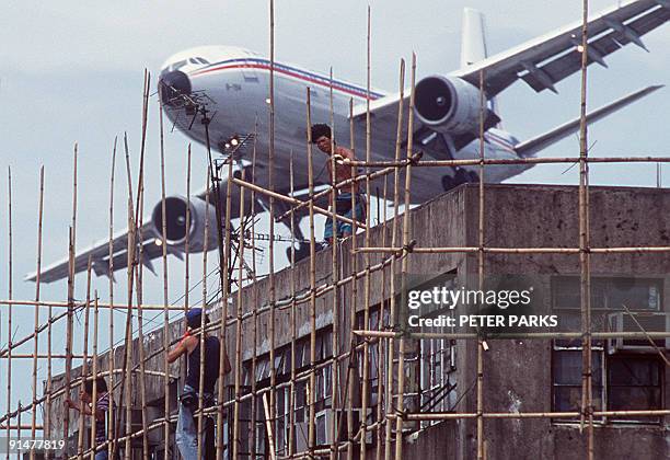 HongKong-property-land-KaiTak,FEATURE by Adrian Addison This file photo taken in April, 1997 shows a jet coming in to land at Hong Kong's old Kai Tak...