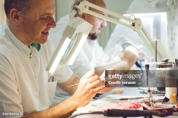 process of making dental prosthesis - acrylic fiber stock pictures, royalty-free photos & images