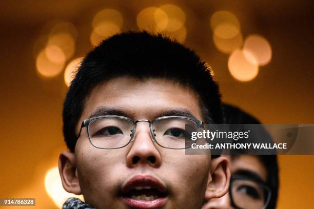 Democracy activist Joshua Wong and Alex Chow speak outside the Court of Final Appeal after walking free in an appeal victory in Hong Kong on February...