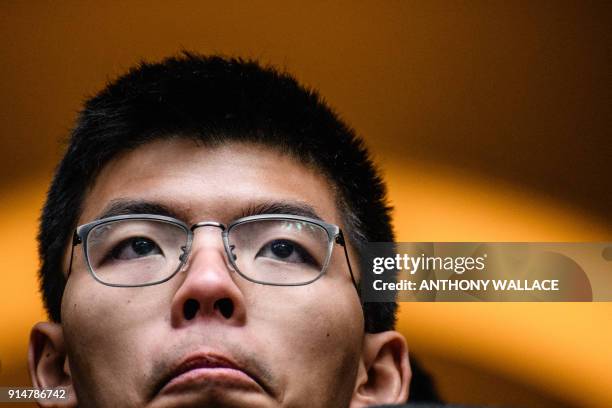 Democracy activist Joshua Wong reacts outside the Court of Final Appeal after walking free in an appeal victory in Hong Kong on February 6, 2018. -...