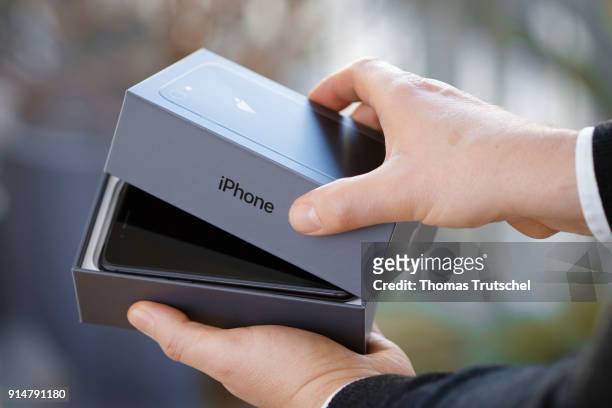 An Apple iphone 8 is taken out of the box on February 06, 2018 in Berlin, Germany.