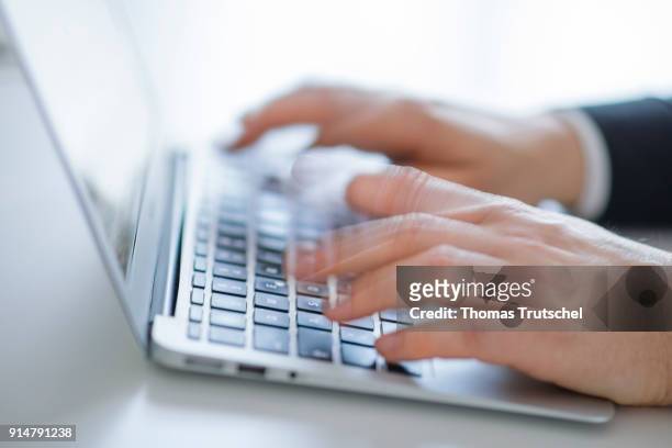 Hands typing on a computer keyboard on February 06, 2018 in Berlin, Germany.