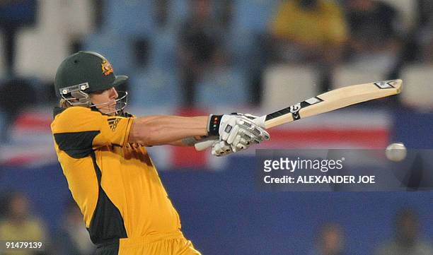 Australian batsman Shane Watson plays a stroke off a delivery by New Zealand's bowler Kyle Mills during The ICC Champions Trophy final between...