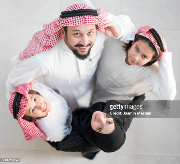 muslim arabic family circle - dubai cares stock pictures, royalty-free photos & images