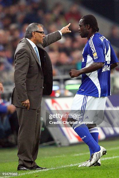 Head coach Felix Magath of Schalke issues instructions to the team to Gerald Asamoah of during the Bundesliga match between FC Schalke 04 and...