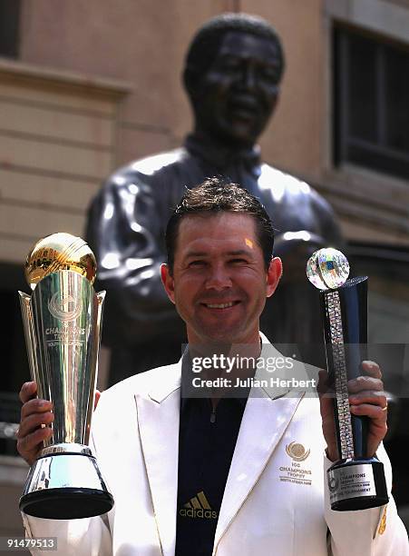 Australia Cricket Team Captain Ricky Ponting poses with The ICC Champions Trophy and The Player Of The Tournament Trophy in Nelson Mandela Square the...