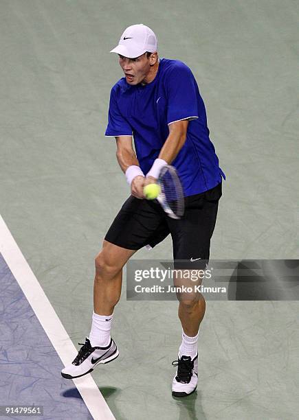 Tomas Berdych of the Czech Republic plays a backhand in his match against Go Soeda of Japan during day two of the Rakuten Open Tennis tournament at...