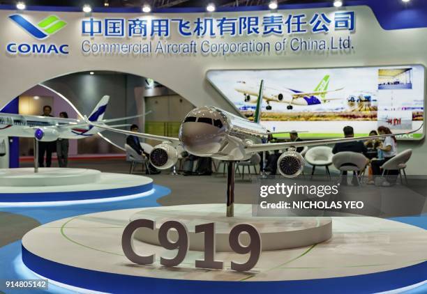 Model of the COMAC C919 single-aisle aircraft is pictured during the Singapore Air Show on February 6, 2018. China's state-owned plane-maker said...