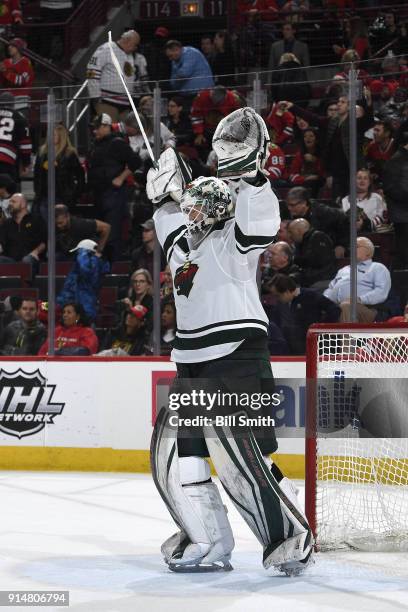 Goalie Devan Dubnyk of the Minnesota Wild reacts after defeating the Chicago Blackhawks 2-1 at the United Center on January 10, 2018 in Chicago,...