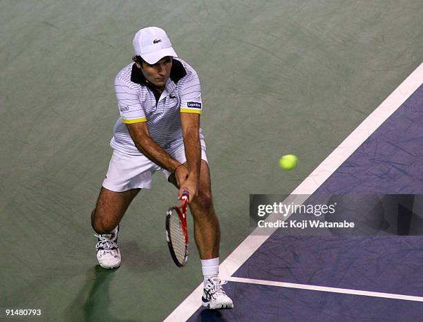 Fabrice Santoro of France plays a forehand in his match against Andrey Golubev of Kazakhstan during day two of the Rakuten Open Tennis tournament at...