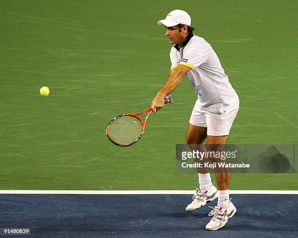 Fabrice Santoro of France plays a forehand in his match against Andrey Golubev of Kazakhstan during day two of the Rakuten Open Tennis tournament at...