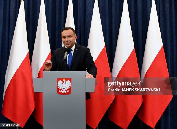 Poland's President Andrzej Duda gives a press conference on February 6, 2018 in Warsaw to announces that he will sign into law a controversial...