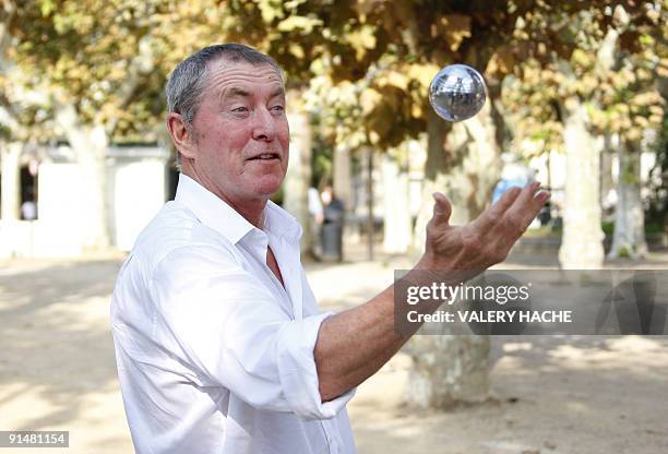 British actor John Nettles plays Petanque during a photocall for the "Midsomer Murders" TV show at the 25th edition of the MIPCOM on October 6, 2009...