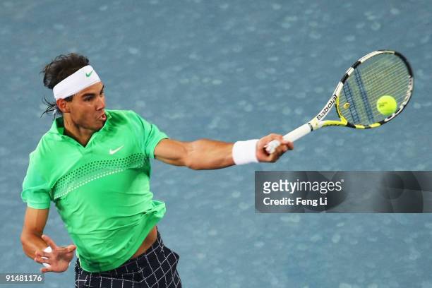 Rafael Nadal of Spain returns a shot against Marcos Baghdatis of Cyprus in his first round match during day five of the 2009 China Open at the...