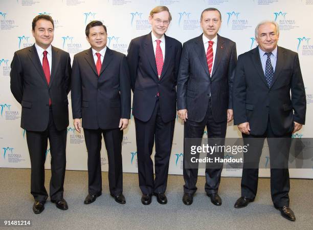 In this handout image supplied by the IMF, International Monetary Fund's Turkey's Deputy Prime Minister Ali Babacan , Chairman of the Board of...