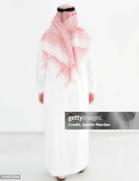 modern young arabian man - rear view - ghoutra stock pictures, royalty-free photos & images