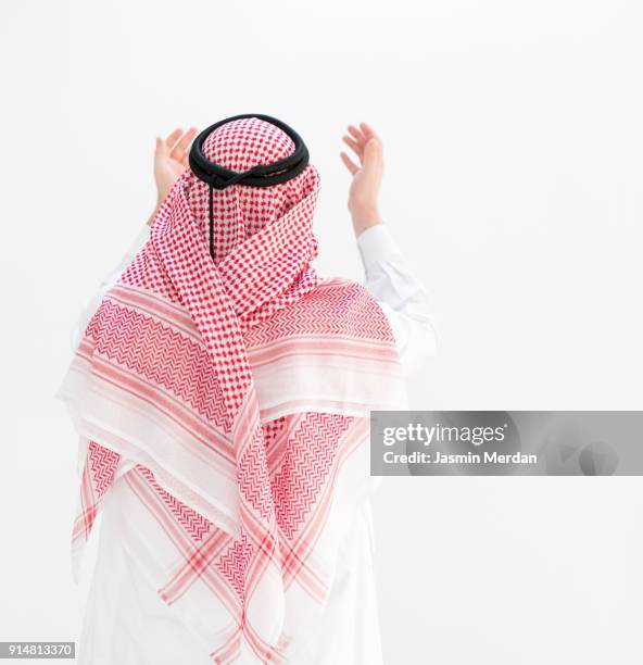 modern young arabian man - rear view - ghoutra stock pictures, royalty-free photos & images