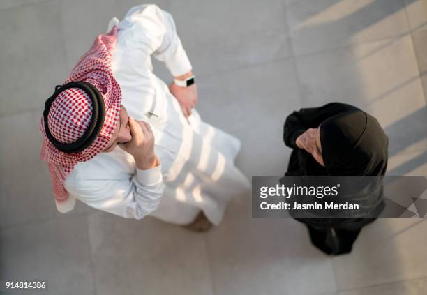 arabic male and female top view - saudi youth stock pictures, royalty-free photos & images