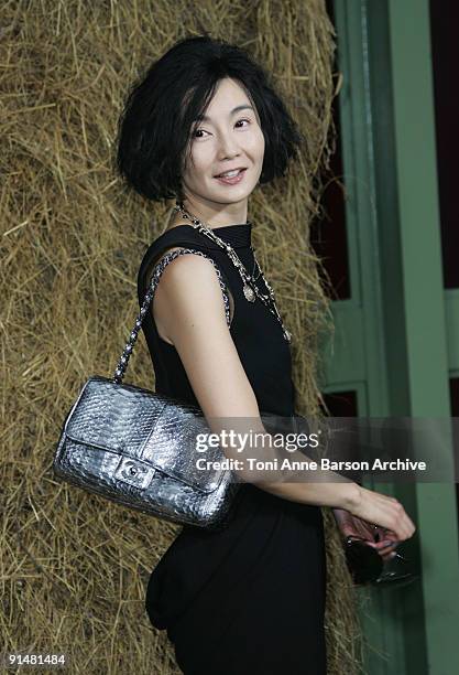 Maggie Cheung attends the Chanel Pret a Porter show as part of the Paris Womenswear Fashion Week Spring/Summer 2010 at the Grand Palais on October 6,...