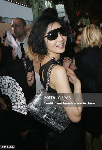 Maggie Cheung attends the Chanel Pret a Porter show as part of the Paris Womenswear Fashion Week Spring/Summer 2010 at the Grand Palais on October 6,...