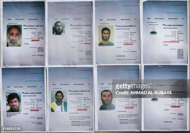 Picture shows printed profiles of Islamic State group members released by Iraqi authorities on February 6, 2018 in Baghdad. Iraqi authorities issued...