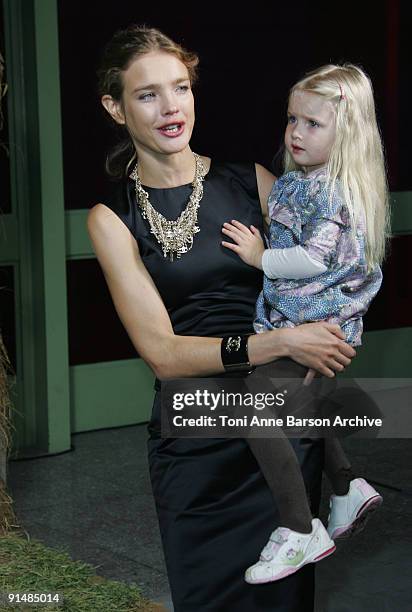 Natalia Vodianova and daughter attend the Chanel Pret a Porter show as part of the Paris Womenswear Fashion Week Spring/Summer 2010 at the Grand...