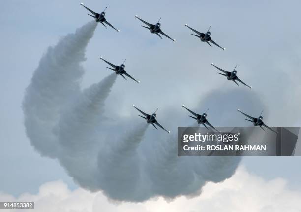 This photograph taken on February 4, 2018 shows the Republic of Korea Air Force Black Eagles aerobatic team performing aerial display during media...