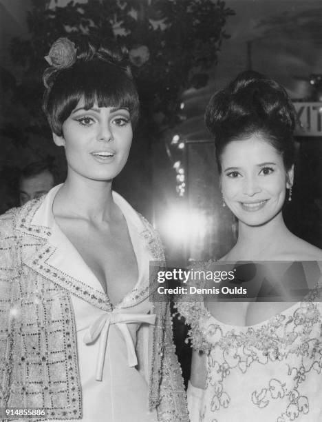 Israeli actress Daliah Lavi with French actress Marie-José Nat at the Royal Film Performance of the film 'Lord Jim' at the Odeon Theatre, Leicester...