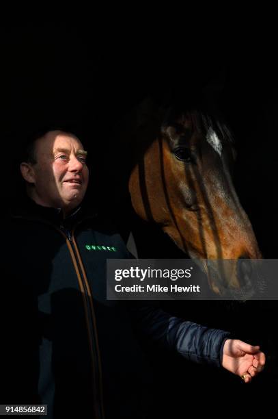 Nicky Henderson poses for a photo with top chaser Altior at his Lambourne stables ahead of the 2018 Betfair Exchange Chase at Newbury Racecourse on...