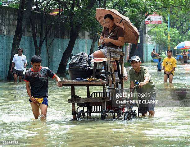 Various modes of transport are used to travel the main thoroughfare of the city of Pasig on the outskirts of Manila on October 1, 2009. Millions of...