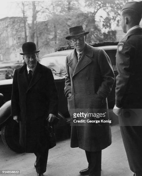 From left to right, Lord Justice Geoffrey Lawrence and Sir Norman Birkett, KC , the British judges presiding at the Nuremberg Trials, arrive at the...